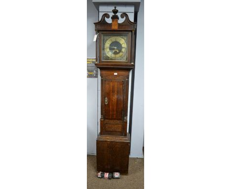 An eight-day oak longcase clock, the 13in. brass and leather-covered dial with Roman hours and Arabic minutes, subsidiary dat