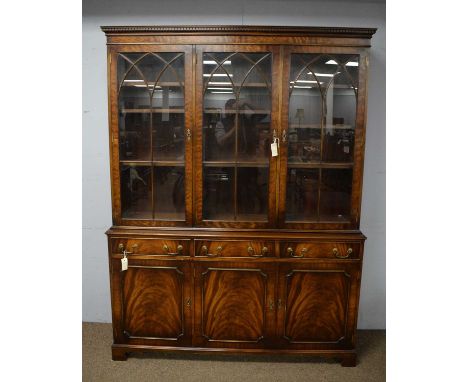 A 20th Century Reprodux Bevan &amp; Funnell Ltd. mahogany bookcase, with projecting dentil moulded cornice above three astrag