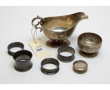 Silver items including a sauceboat, by William Hutton &amp; Sons, Sheffield 1946; a silver table salt; four napkin rings; and