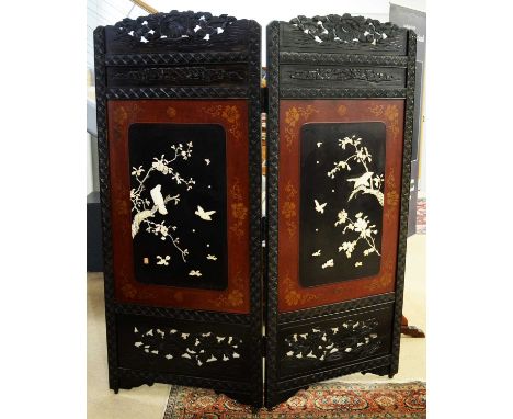A 20th Century Japanese two-fold dressing screen, with chrysanthemum carved top rail, central panel depicting birds amongst f