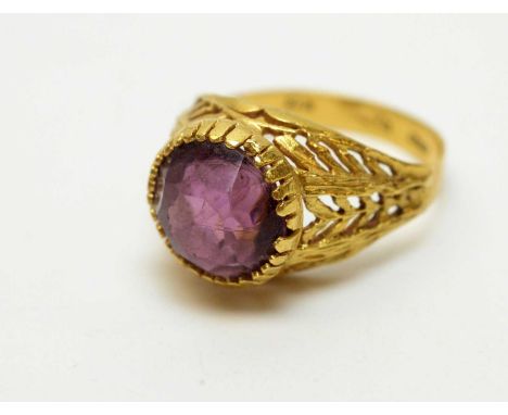 An amethyst ring, in floral decorated 18ct yellow gold shank, ring size M.