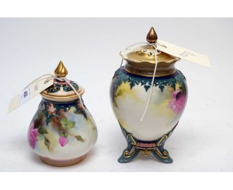 A Royal Worcester Hadley ware jar and cover, with pierced lid, painted with roses and leaves, raised on three feet, 17.5cms h