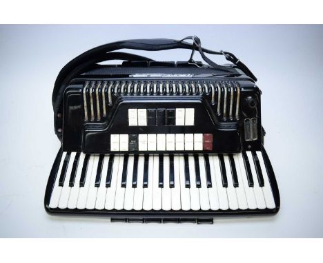 A Condovox 120 Bass Electronic Piano accordion, with eighteen tone selector keys, black finished case with polished metal dec