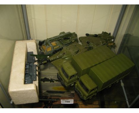 TWO SHELVES OF DINKY, CORGI AND SOLIDO DIE CAST MILITARY VEHICLES 