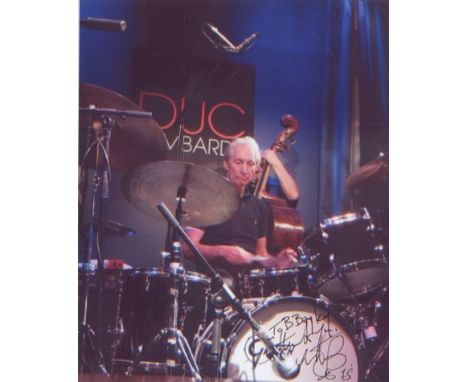 Rolling Stones - Charlie Watts. A dedicated signed 10 x 8 inch photo of Watts behind the drums.  Good condition All signed it