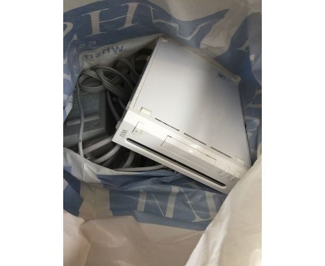 A Wii console with cables and sensor. 