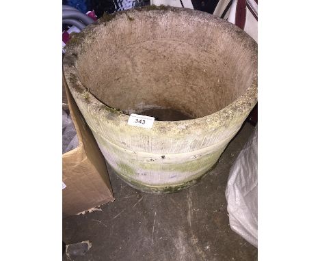 A stone barrel shape planter 