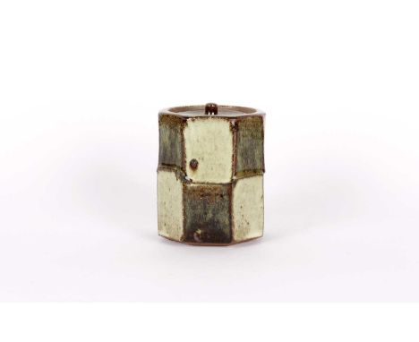 Phil Rogers (British 1951-2020) Stoneware Jar with Cover Wood fired, the octagonal body facet cut and glazed in alternating o