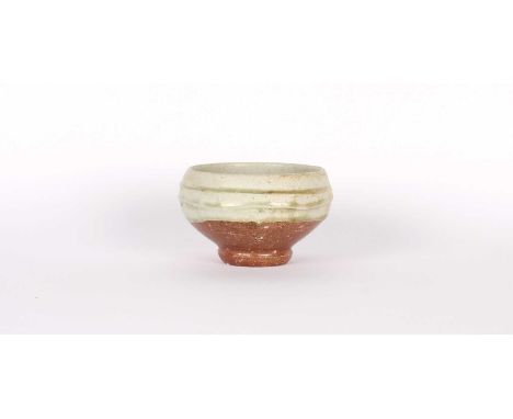 Phil Rogers (British 1951-2020) Stoneware Chawan Wood fired with elm ash glaze in pale celadon, the glaze pooled and 'crystal