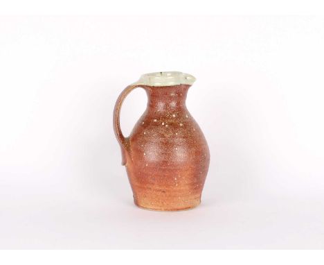 Phil Rogers (British 1951-2020) Stoneware Jug Circa 2019/20, wood fired with nuka glaze to interior and overlapping rim, impr