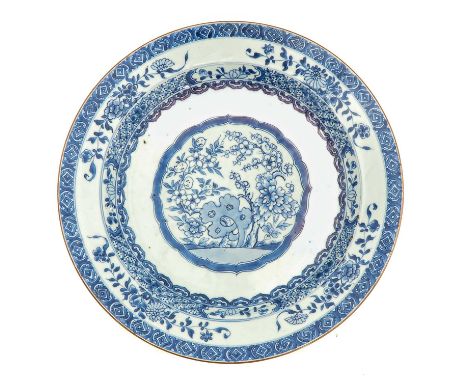 Depicting scene in garden with flowers, 18th Century, 42 cm. in diameter, baking fault on stand ring, fritting on edge.