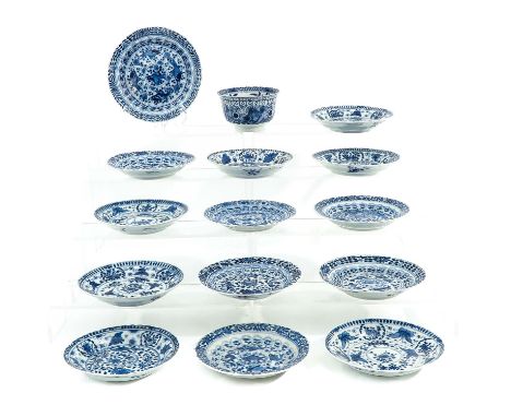 Including 1 cup and 14 saucers, decorated with butterflies and flowers, saucers are 15 cm. in diameter, chip and hairline. 