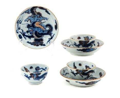 Dragon and cloud decor, saucers are 12 cm. in diameter, chip and hairline.