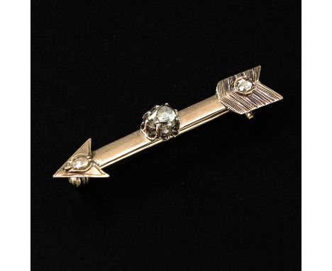 In the form of an arrow, set with 2 rose cut diamonds, 53 mm. long.