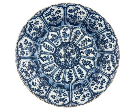 Flora decor, 18th Century, marked with double ring and Lozenge, 28 cm. in diameter, chip and hairline.