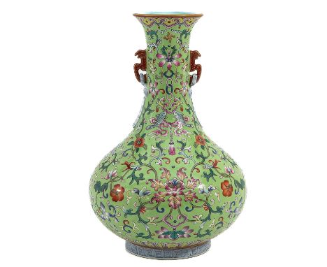 Light green ground decorated with flowers in in Famille Rose enamels, Qianlong mark, 29 cm. tall. 