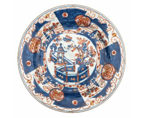 Depicting scene in garden with flowers and pagoda, 18th Century, marked with double ring and conch shell, 35 cm. in diameter,