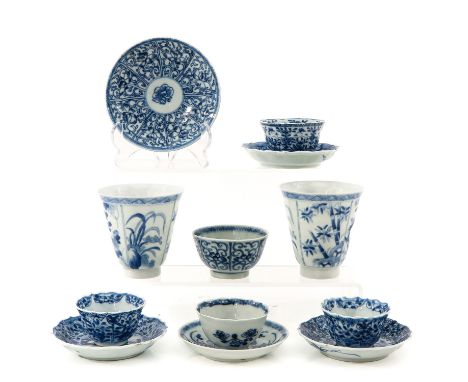 12 pieces, including 7 cups and 5 saucers, in blue and white decors, including 18th Century, largest saucer is 12 cm. in diam