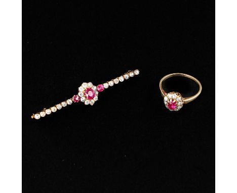 Set with diamonds, pin is 52 mm. long, ring size is 16.