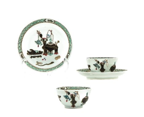 Decorated with Chinese antiquities, 18th Century, saucers are 12 cm. in diameter, chip and hairline.