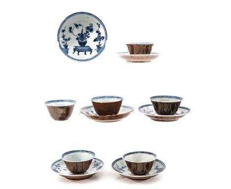 Batavianware ground decorated with blue and white flowers and Chinese antiquities, 18th Century, saucers are 10 cm. in diamet