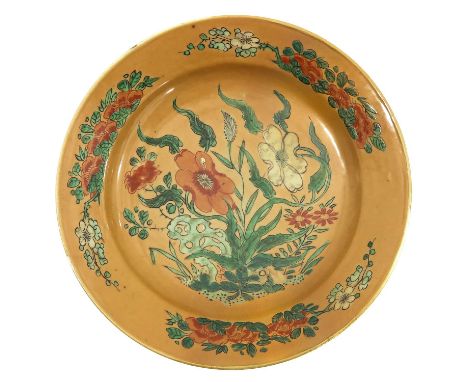 Decorated with flowers, marked with double ring and flower, 21 cm. in diameter, restored.