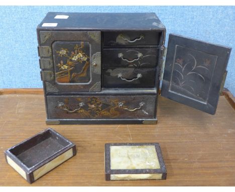 A Japanese black lacquer jewellery cabinet and a carved soapstone trinket box