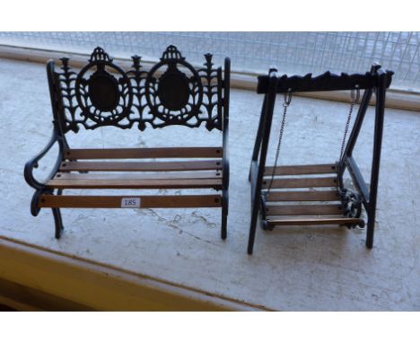 A miniature cast garden bench and a miniature cast garden swing