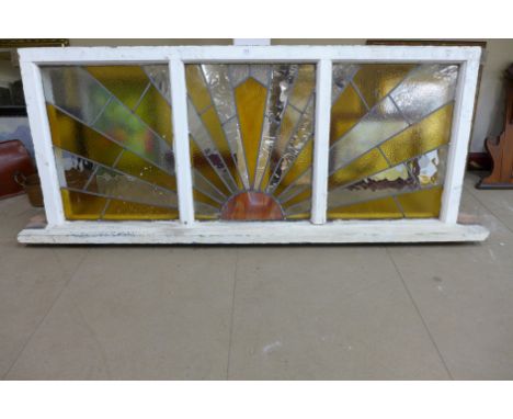An Art Deco stained glass sunburst three panel window