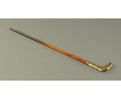 A horn and malacca double edged sword stick, late 19th century, the horn handle inset with five ivory dominoes (one missing) 