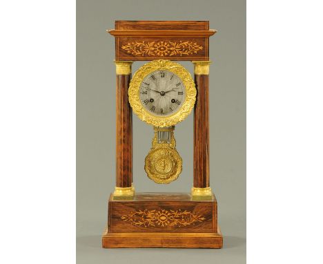 A rosewood and inlaid portico clock, 19th century, typical form, with inlaid pediment above a silvered dial in gilt metal swa