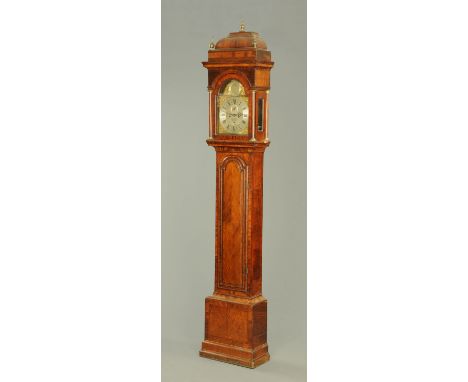 A Georgian walnut longcase clock by Godfrie Poy of London, with two-train striking movement and silvered brass arched dial, t