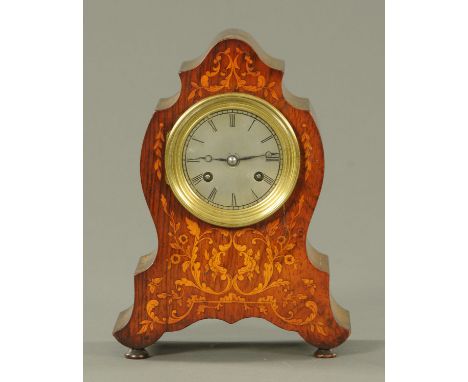 An Edwardian inlaid rosewood mantle clock, with two-train spring driven movement and silvered brass dial with Roman numerals.