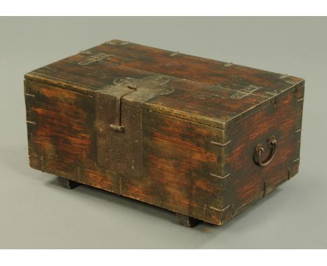 A 19th century iron bound stained wooden trunk, with carrying handle to either side.  Width 80 cm. 