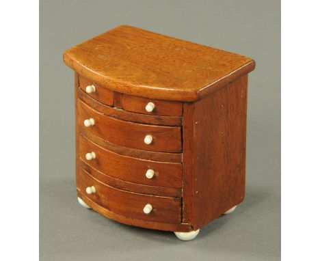 An apprentice piece miniature mahogany chest of drawers, 19th century, with bowfront above two short and three long drawers e