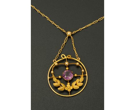 A gold coloured necklace, with amethyst set circular gold coloured metal mount, 3.7 grams gross.