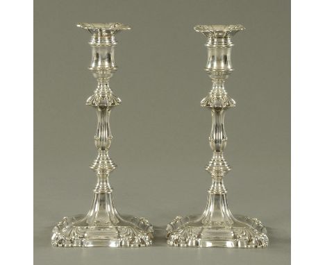 A pair of William IV silver candlesticks, Kitchen Walker & Curr, Sheffield 1833, with foliate moulded detachable sconces, urn