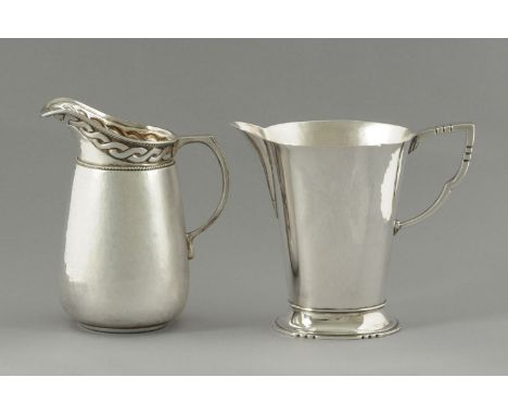 A Liberty & Co. cream jug, Birmingham 1933, with intertwined ribbon band between rope twist borders above the planished body,