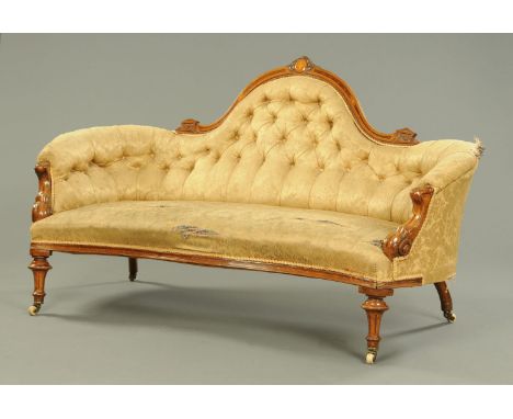 A Victorian inlaid walnut sofa, of shaped outline and with exposed moulded showframe.  Width 182 cm (see illustration).