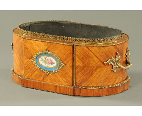 A 19th century Continental kingwood and metal mounted planter, with porcelain plaque.  Width 41 cm (see illustration). 