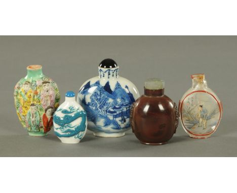 An assortment of Chinese snuff bottles, 19th/20th century, to include a Famille Verte example relief moulded with eight deiti