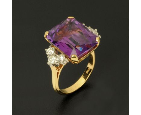 An 18 ct yellow gold amethyst and diamond set ring, +/- 1 carat of diamonds, size M/N.  Amethyst dimensions +/- 17 mm x 14 mm