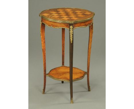 A Victorian walnut and satinwood chess topped table, with metal mounts, cabriole legs and low shelf.  Diameter 45 cm. 