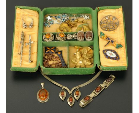 A quantity of predominantly early 20th century costume jewellery, to include enamel brooches, silver and amber Celtic style e