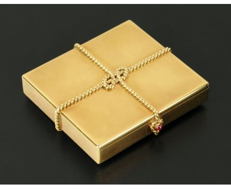 Cartier, London, 9 ct gold powder compact set with a cabochon ruby, London 1948, square form, with rope twist decoration knot