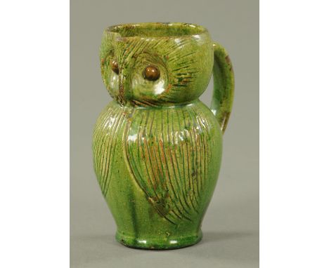 A Farnham type pottery owl, 19th century, with incised feathers against a green ground.  Height 13.8 cm.    CONDITION REPORT: