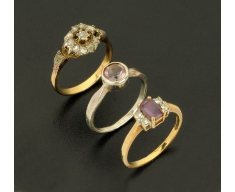 A 9 ct gold amethyst and diamond ring, 9 ct gold ring and a silver ring with amethyst coloured stone. 