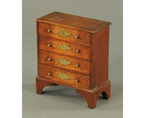 A rare oak and pine miniature chest of drawers by John Bubb, early 19th century, with four long drawers each with hand cut br