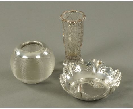 A pierced silver bonbon dish, Viners, Sheffield 1946, a silver mounted glass match striker and a Continental silver overlaid 