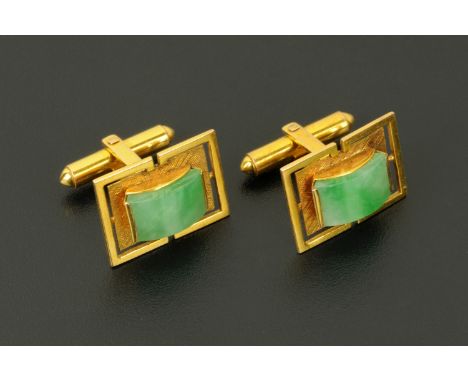A pair of Chinese 14 ct gold and jade cufflinks, mid 20th century (see illustration).